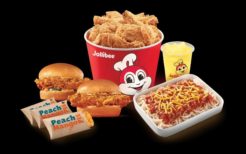 Jollibee bucket treat with chicken sandwiches, peach mango pies, jolly spaghetti, and pineapple quencher.