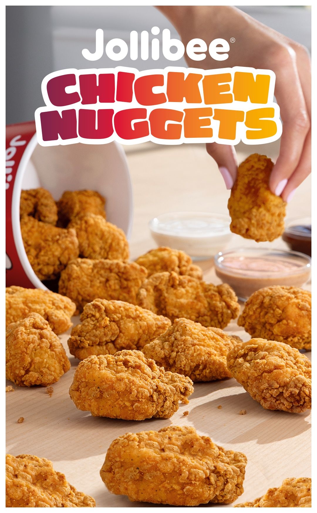 Chicken nuggets pieces and one being held by a hand with 'Jollibee Chicken Nuggets' text.